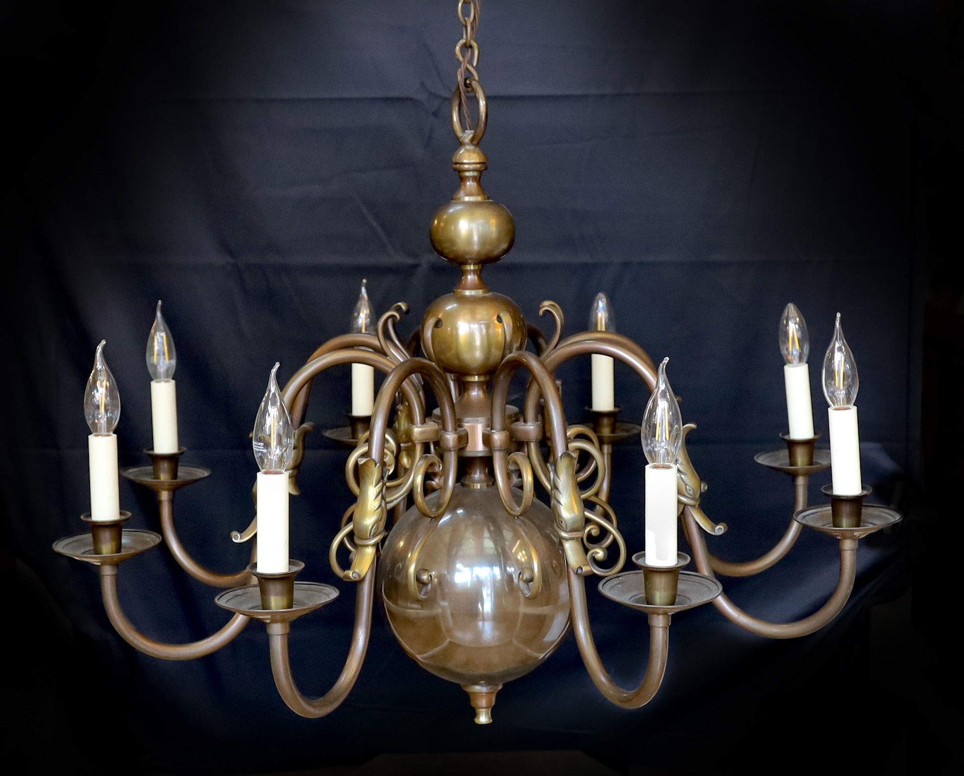 A large Dutch bronzed brass eight light chandelier, drop 70cm. width 86cm